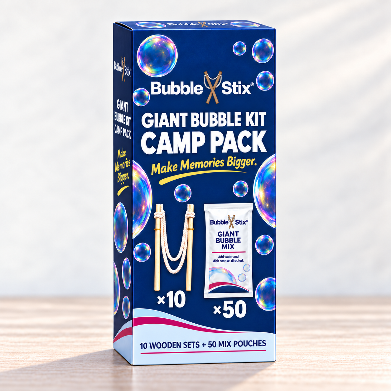 Single large navy Camp Pack carton concept with wooden-set ×10 and mix-pouch ×50 graphics